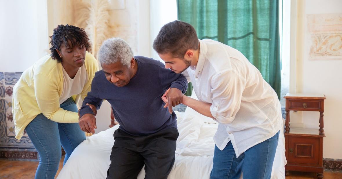 Professional carer assisting a senior at home