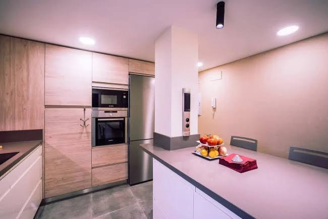 Craftsman fitting a premium kitchen in London